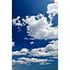 Background of blue sky with white cumulus clouds