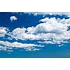 Background of blue sky with white cumulus clouds