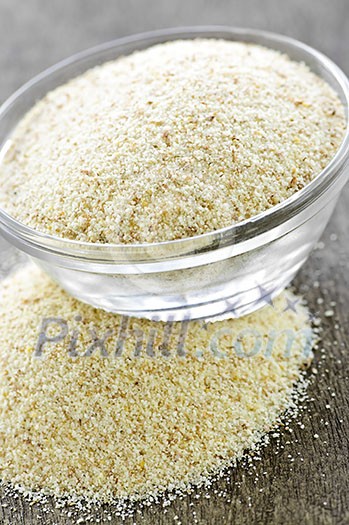 Dry cream of wheat cereal in a glass bowl Dry cream of wheat cereal in a glass bowl