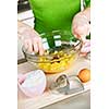 Mixing ingredients for baking cookies in glass bowl