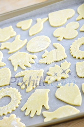 Cookie tray with raw homemade cookies ready for baking Cookie tray with raw homemade cookies ready for baking