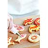 Decorating homemade shortbread cookies with icing from piping bag