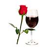 Romantic glass of red wine with long stemmed rose