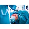 Knee surgery, Orthopedic Operation  - two surgeons performing a knee surgery on a patient (shallow DOF; color toned image)