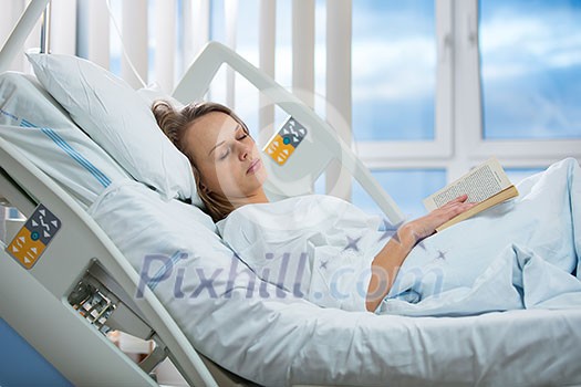 Pretty, young, female patient in a modern hospital room. Getting better fast after a surgery - pensive yet positive, thinking ahead, making plans (shallow DOF; color toned image) Pretty, young, female patient in a modern hospital room. Getting better fast after a surgery - pensive yet positive, thinking ahead, making plans (shallow DOF; color toned image)