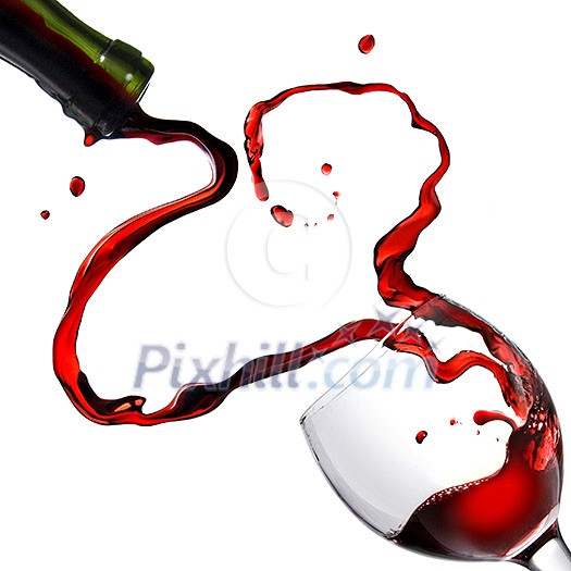 Heart from pouring red wine in goblet isolated on white