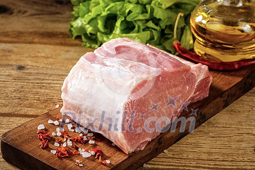 Raw pork loin with salt and herbs Raw pork loin with salt and herbs