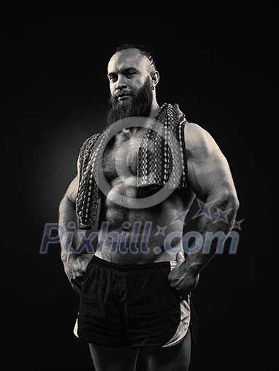 Portrait of bearded strong man with perfect abs, pecs shoulders,biceps, triceps and chest, with towel. Portrait of bearded strong man with perfect abs, pecs shoulders,biceps, triceps and chest, with towel.