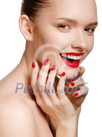Young smiling woman with red lips and red nails, touching her face isolated on white background