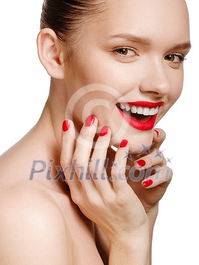 Young smiling woman with red lips and red nails, touching her face isolated on white background Young smiling woman with red lips and red nails, touching her face isolated on white background