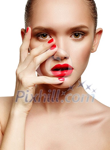 Young woman with red lips and red nails, touching her face isolated on white background Young woman with red lips and red nails, touching her face isolated on white background