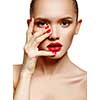 Young woman with red lips and red nails, touching her face isolated on white background