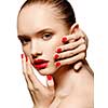 Young woman with red lips and red nails, touching her face isolated on white background