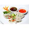 chinese rolls with vegetables on the plate