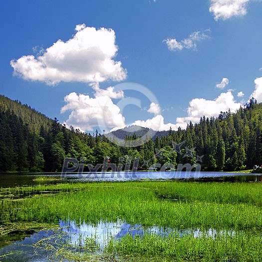Summer landscape with mountains and blue lake
