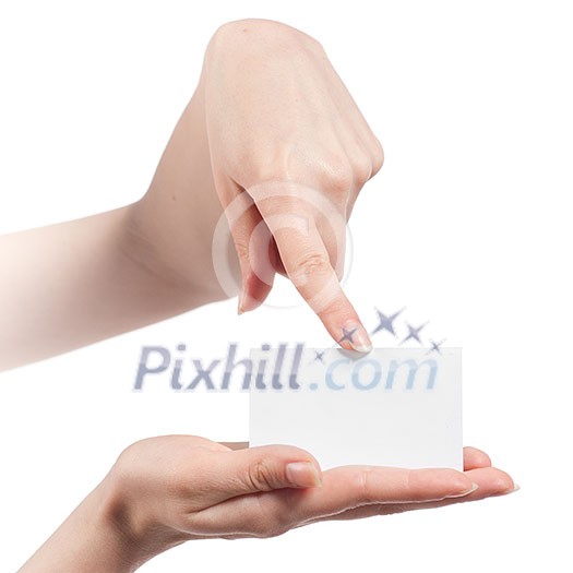 Womans hands holding and pointing empty visiting card isolated on white Womans hands holding and pointing empty visiting card isolated on white