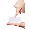 Womans hands holding and pointing empty visiting card isolated on white