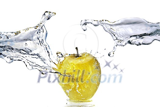 perfect fresh water splash on yellow apple isolated on white
