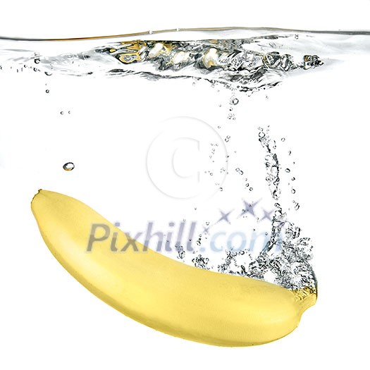banana dropped into water isolated on white
