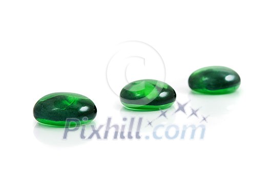 zen-like spa green shiny stones isolated on white