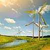 Green energy concept - natural wind generator turbines on summer landscape