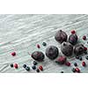 Fresh figs and blueberries on a gray wooden background