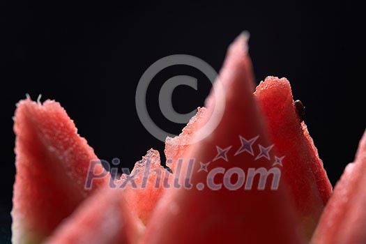 slices of watermelon isolated on black background