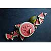 pieces of fresh watermelon with melon on a black background