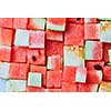 food background from cubes of red watermelon