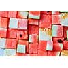 food background from cubes of red watermelon