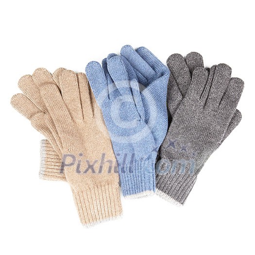 many colored gloves. Winter accessories isolated on white background.