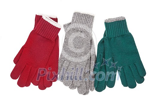 Three pair of colored gloves. Winter accessories isolated on white background.
