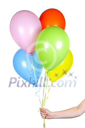 Hand holding colorful helium balloons isolated on white background