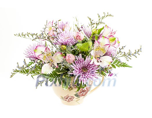 Bouquet of colorful flowers arranged in small vase isolated on white background