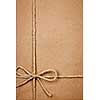 Brown paper gift package background with twine and copy space