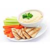 Healthy snack of hummus dip with pita bread slices and vegetables