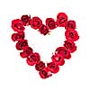 Heart made of fresh red roses on white background