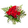 Bouquet of fresh red roses in a vase isolated on white background