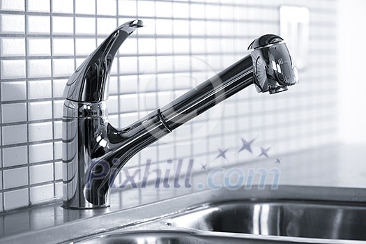 Stainless steel kitchen faucet and sink with tile backsplash Stainless steel kitchen faucet and sink with tile backsplash