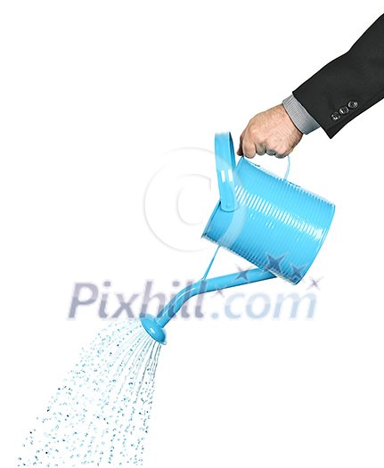 Hand of a businessman pouring water from watering can Hand of a businessman pouring water from watering can