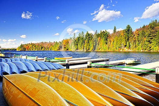 Canoes for rent on fall lake in Algonquin Park, Ontario, Canada Canoes for rent on fall lake in Algonquin Park, Ontario, Canada