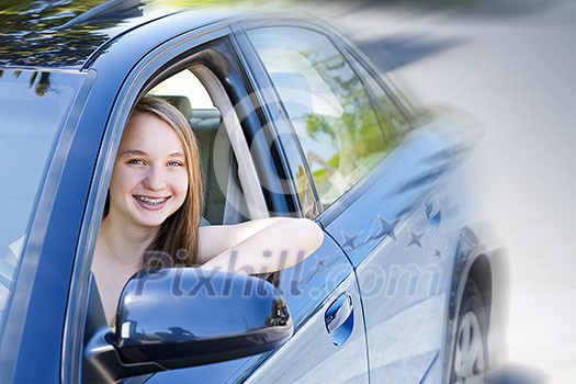 Teenage female driving student learning to drive a car