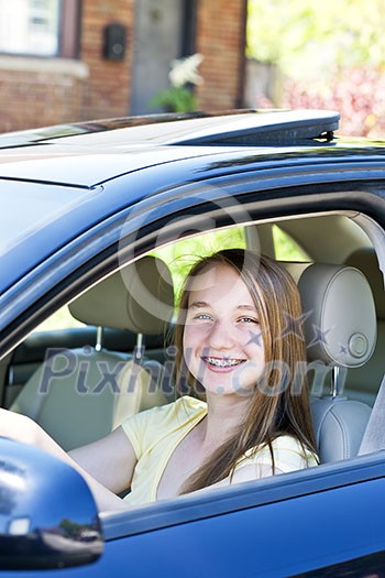 Teenage female driving student learning to drive a car Teenage female driving student learning to drive a car