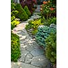 Natural flagstone path landscaping in home garden