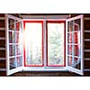 Open windows in cottage with sunshine and view of forest