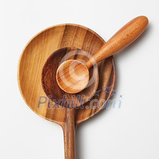 Wooden spoons of different sizes isolated on white