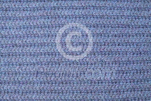 knit texture of blue wool knitted fabric with pattern as background knit texture of blue wool knitted fabric with pattern as background
