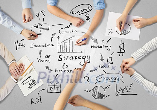 Top view of people hands drawing business teamwork strategy Top view of people hands drawing business teamwork strategy