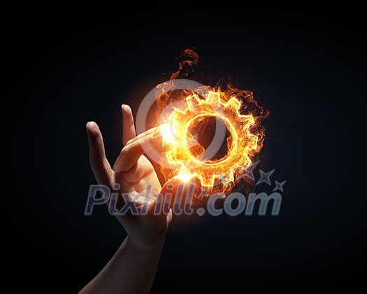 Finger touch glowing light setting symbol on dark background