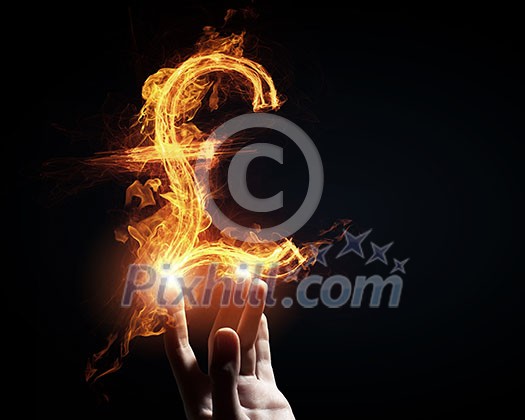 Burning pound sign in businessman palm on dark background